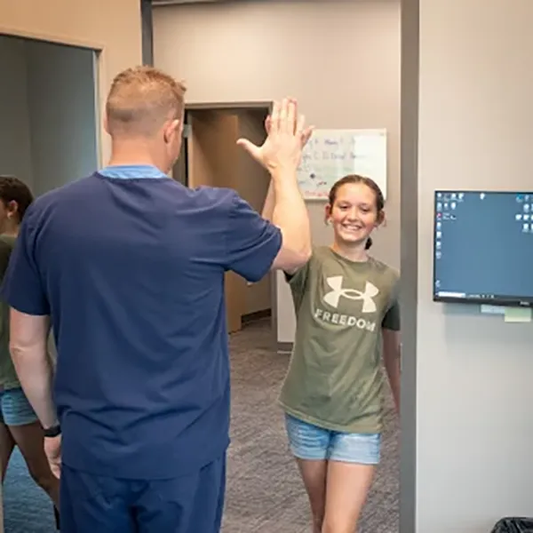 Chiropractor Dr. Nick Heiss With Chiropractic Patient in South Lincoln, NE.